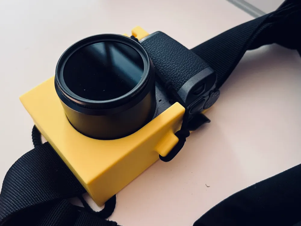 Holster on a backpack strap